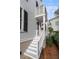 White stairs and railing leading to the home's entrance at 28 Dereef Ct, Charleston, SC 29403