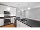 Modern kitchen with stainless steel appliances and dark countertops at 28 Dereef Ct, Charleston, SC 29403