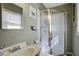 Small bathroom with shower stall, sink, and linen storage at 303 Holly Avenue Ave, Goose Creek, SC 29445