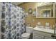 Clean bathroom with floral shower curtain and white vanity at 303 Holly Avenue Ave, Goose Creek, SC 29445