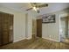 Spacious bedroom with hardwood floors, ceiling fan, and built-in closet at 303 Holly Avenue Ave, Goose Creek, SC 29445