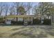 Brick ranch house with a large front yard at 303 Holly Avenue Ave, Goose Creek, SC 29445