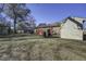 Back of house with brick exterior and small shed at 303 Holly Avenue Ave, Goose Creek, SC 29445