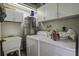 Functional laundry room with washer, dryer, and utility sink at 303 Holly Avenue Ave, Goose Creek, SC 29445