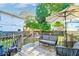 Relaxing backyard deck with seating and shade umbrella at 33 Cypress St, Charleston, SC 29403