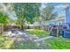 Landscaped backyard with firepit and wooden fence at 33 Cypress St, Charleston, SC 29403
