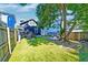 Spacious backyard with a large tree and wooden fence at 33 Cypress St, Charleston, SC 29403