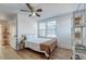 Bedroom with a queen bed, ceiling fan, and built-in shelving at 33 Cypress St, Charleston, SC 29403