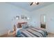 Cozy bedroom with a teal colored bed and ample natural light at 33 Cypress St, Charleston, SC 29403
