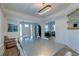 Open concept dining room with metal table, hardwood floors, and view to living area at 33 Cypress St, Charleston, SC 29403