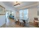 Modern dining room features a large table and kitchen view at 33 Cypress St, Charleston, SC 29403