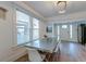 Modern dining room with metal table and hardwood floors, near entry at 33 Cypress St, Charleston, SC 29403