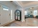Bright entryway with hardwood floors and an antique cabinet at 33 Cypress St, Charleston, SC 29403