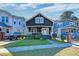 Charming renovated home with a dark exterior, white trim, and a manicured lawn at 33 Cypress St, Charleston, SC 29403
