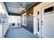 Inviting front porch features a porch swing and ceiling fan at 33 Cypress St, Charleston, SC 29403