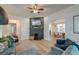 Open living room featuring a fireplace and view into dining area at 33 Cypress St, Charleston, SC 29403