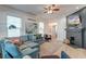 Bright living room featuring a comfortable sectional sofa, fireplace, and large TV at 33 Cypress St, Charleston, SC 29403