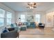 Bright living room featuring a comfy sectional sofa and large window at 33 Cypress St, Charleston, SC 29403
