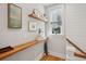 Open landing with floating shelves and natural light at 375 Huger St # B, Charleston, SC 29403