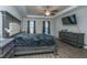 Main bedroom with king-size bed, dresser, and ceiling fan at 394 Sanctuary Park Dr, Summerville, SC 29486