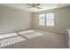 Spacious bedroom with neutral walls and carpet, featuring two large windows at 394 Sanctuary Park Dr, Summerville, SC 29486