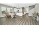 Dining room with a farmhouse table, chairs, and an open view to the kitchen at 394 Sanctuary Park Dr, Summerville, SC 29486