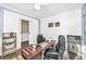 Home office with a desk, chair, and white shiplap accent wall at 394 Sanctuary Park Dr, Summerville, SC 29486