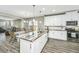 Open concept kitchen with island, granite countertops, and stainless steel appliances at 394 Sanctuary Park Dr, Summerville, SC 29486