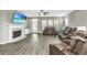 Spacious living room with fireplace, large TV, and brown leather reclining furniture at 394 Sanctuary Park Dr, Summerville, SC 29486