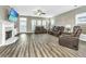 Spacious living room with a fireplace, large TV, and brown leather reclining furniture at 394 Sanctuary Park Dr, Summerville, SC 29486