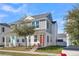 Two-story house with gray siding, white accents, and a coral door at 3955 Four Poles Park Dr, North Charleston, SC 29405