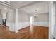 Bright dining room with hardwood floors, chandelier, and wainscoting at 4154 Jean Laffite Rd, Hollywood, SC 29449