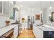 White kitchen with marble countertops and stainless steel appliances at 416 Bank St, Mount Pleasant, SC 29464