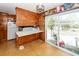 Kitchen with wood cabinets and sliding glass door at 427 Judy Dr, Goose Creek, SC 29445