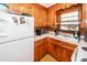 Kitchen with wood cabinets and white appliances at 427 Judy Dr, Goose Creek, SC 29445