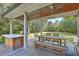 Covered patio with outdoor dining set and built-in grill at 428 Howle Ave, Charleston, SC 29412