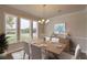 Bright dining room featuring a wooden table, white chairs, and large windows at 470 White Magnolia St, Moncks Corner, SC 29461