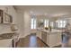 Modern kitchen with white cabinets, an island, and stainless steel appliances at 470 White Magnolia St, Moncks Corner, SC 29461