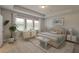 Spacious main bedroom with large windows, plush bed, and dresser at 470 White Magnolia St, Moncks Corner, SC 29461
