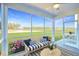 Relaxing screened porch overlooking a pond and lush landscape at 470 White Magnolia St, Moncks Corner, SC 29461