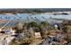 Aerial view showing new home construction and waterfront property with community boat docks at 5655 Captain Kidd Rd, Hollywood, SC 29449