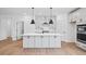 Modern kitchen with white cabinets, quartz countertops, and an island at 5655 Captain Kidd Rd, Hollywood, SC 29449