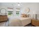 Relaxing bedroom with a comfy bed, neutral tones, and natural light at 769 Opal Wing St, Moncks Corner, SC 29461