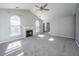 Bright living room with vaulted ceiling, fireplace, and carpet flooring at 8505 Mayfield Ct, North Charleston, SC 29406