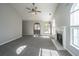 Sunlit living room featuring a fireplace and access to the dining area at 8505 Mayfield Ct, North Charleston, SC 29406