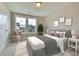 Cozy bedroom with gray bedding, ample natural light, and a window seat at 8623 Connor Ct, North Charleston, SC 29406