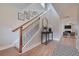 Bright entryway with hardwood floors, staircase, and view to living room at 8623 Connor Ct, North Charleston, SC 29406