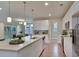 Modern kitchen featuring white cabinets, large island, and stainless steel appliances at 8623 Connor Ct, North Charleston, SC 29406