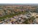 Aerial view of houses nestled along a serene lake, surrounded by autumn foliage at 1014 Ariel Ct, Summerville, SC 29485