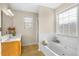 Bathroom with soaking tub, shower, and wood vanity at 1014 Ariel Ct, Summerville, SC 29485
